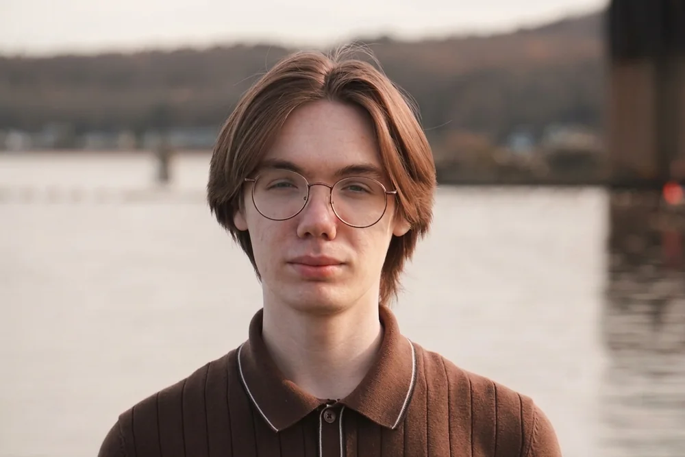 William Block standing outside by the water