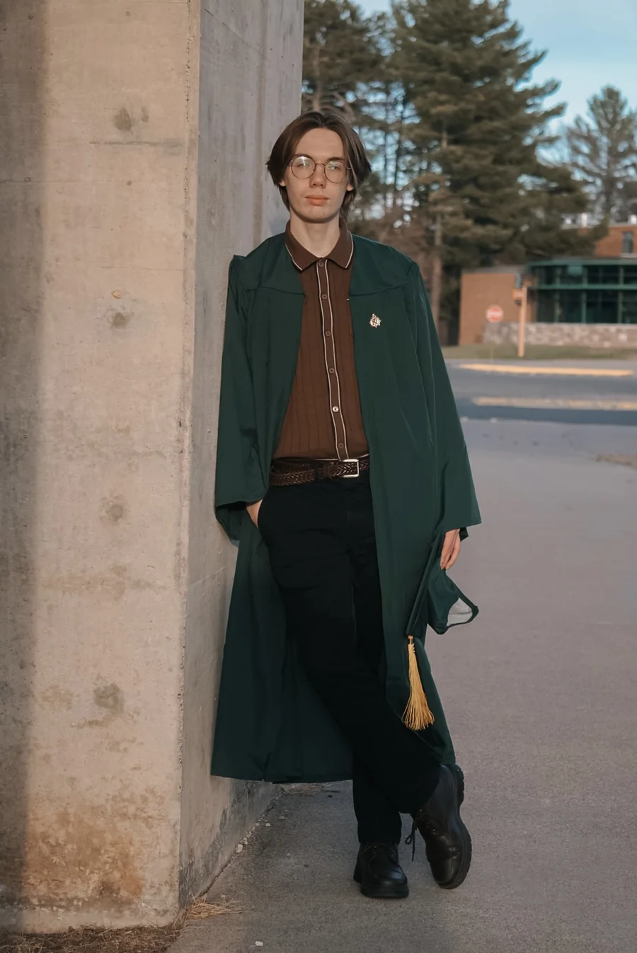 William Block leaning against a wall on NMU's campus